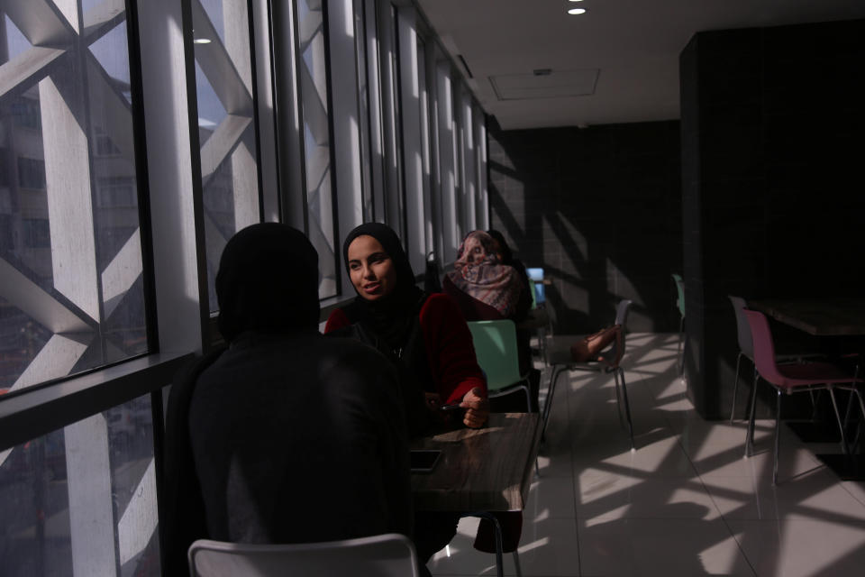 Palestinian women wait for their order at a food court in a mall in Gaza City, Nov. 28, 2018. (Photo: Samar Abo Elouf/Reuters)