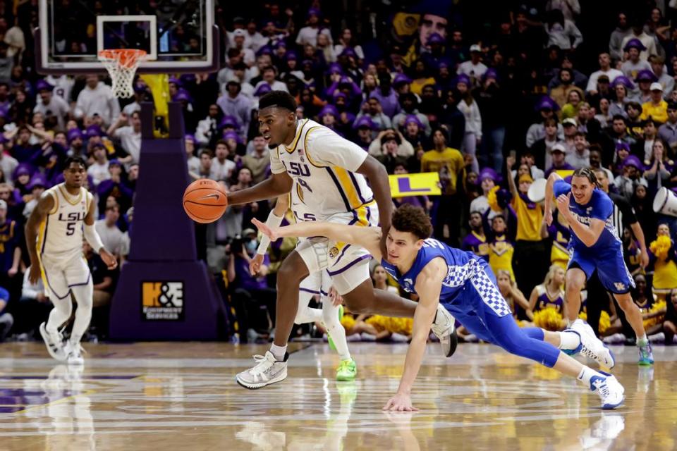 LSU forward Darius Days (4) got by Kentucky guard Kellan Grady in the second half in Baton Rouge, La. Days finished with nine points and seven rebounds while Grady had 13 points and two assists.