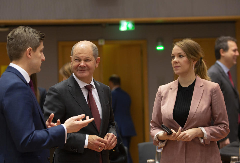 Croatia's Finance Minister Zdravko Maric and Finnish counterpart Katri Kulmuni, right, and German Finance Minister Olaf Scholz, center,during a meeting of EU finance ministers at the Europa building in Brussels, Tuesday, Feb. 18, 2020. EU finance ministers meet Tuesday to discuss tax havens. (AP Photo/Virginia Mayo)