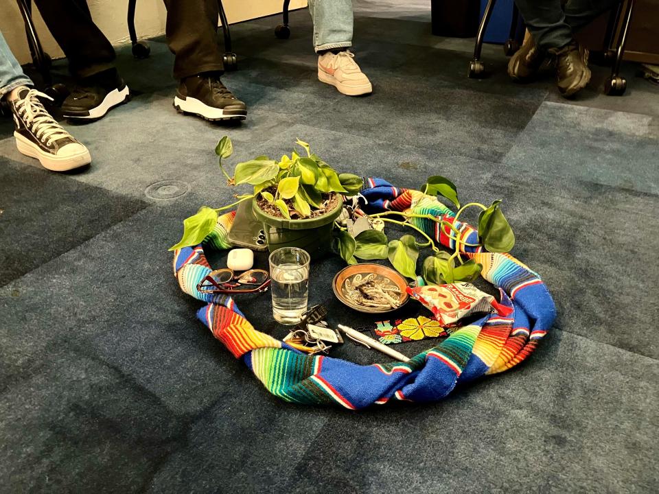 A makeshift altar at the Chispa AZ Community Circle event on April 18, 2024, holds items from community members in attendance and serves to remind them that "We are all part of nature and nature is part of us."