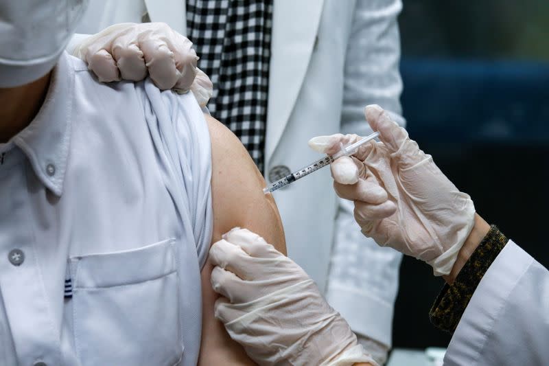 A nursing home worker receives the AstraZeneca COVID-19 vaccine at a health care centre as South Korea starts a vaccination campaign against the coronavirus disease (COVID-19), in Seoul