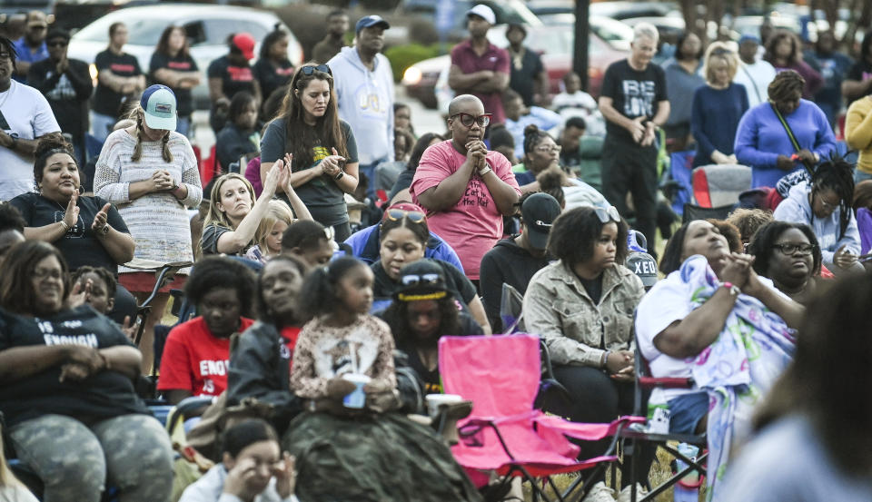 People attending a revival for Steve Perkins in Decatur, Ala. pray during the event on Tuesday, Oct. 10, 2023 in Decatur, Ala. Steve Perkins, 39, was killed by police Sept. 29 in Decatur in a confrontation that began with a tow truck driver trying to repossess Perkins’ truck.(Jeronimo Nisa/The Decatur Daily via AP)