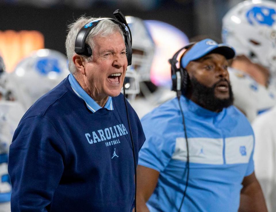 North Carolina coach Mack Brown yells at his defensive unit in the fourth quarter against West Virginia in the Duke’s Mayo Bowl on Wednesday, December 27, 2023 at Bank of American Stadium in Charlotte, N.C. Robert Willett/rwillett@newsobserver.com