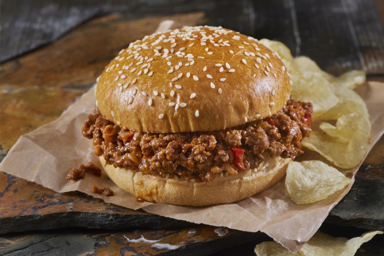 Sloppy Joe Burger on a Brioche Sesame Seed Bun with Potato Chips