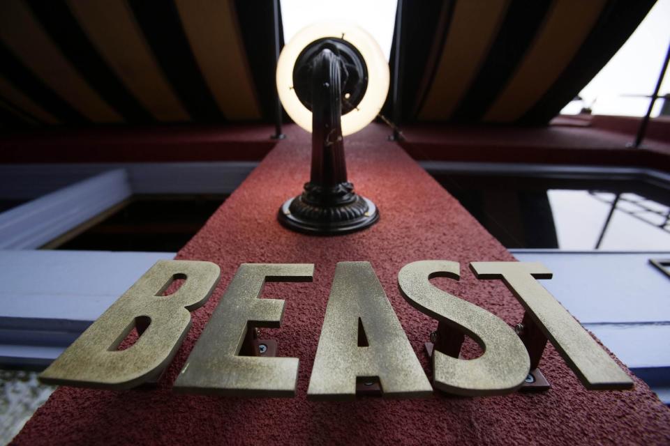 This Sept. 27, 2013 photo shows the entrance sign for Beast restaurant in Portland, Ore., where diners enjoy a six-course prix fixe dinner built around massive flavors and the chef’s penchant for butchering whole animals. The rustic, yet refined menu changes weekly, but you can expect the likes of charcuterie plates with steak tartare and mains of braised pork belly. (AP Photo/Don Ryan)