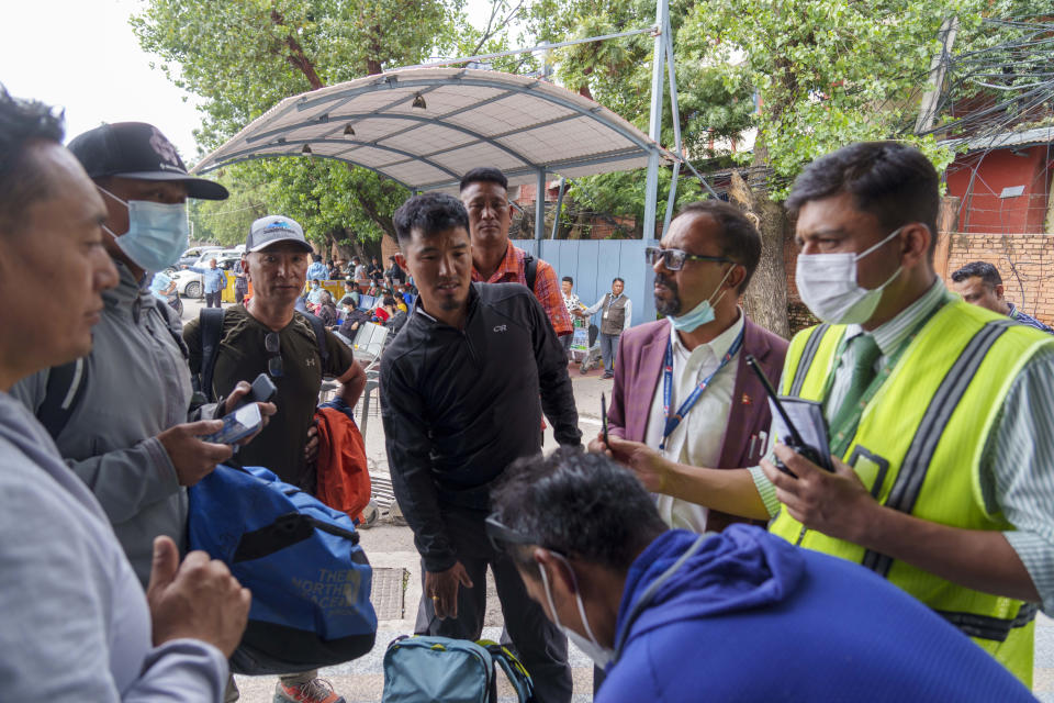 A team of climbers prepare to leave for rescue operations from the Tribhuvan International Airport in Kathmandu, Nepal, Sunday, May 29, 2022. A small airplane with 22 people on board flying on a popular tourist route was missing in Nepal’s mountains on Sunday, an official said. The Tara Airlines plane, which was on a 15-minute scheduled flight to the mountain town of Jomsom, took off from the resort town of Pokhara, 200 kilometers (125 miles) east of Kathmandu. It lost contact with the airport tower shortly after takeoff. (AP Photo/Niranjan Shreshta)