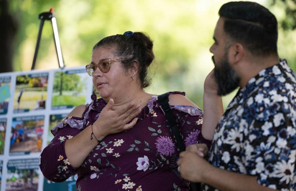 Airport district resident Norma Padilla speaks through an interpreter during the Tuolumne River Regional Park master plan update meeting in Mary Grogan Grove in Modesto, Calif., Thursday, June 7, 2023.