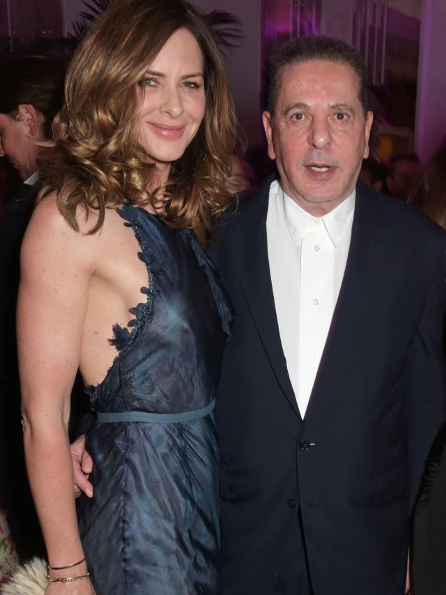 Trinny Woodall in a blue halterneck dress with Charles Saatchi