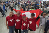 Fans of Swiss tennis legend Roger Federer react as they arrive at the O2 arena in London, Friday, Sept. 23, 2022 ahead of his doubles match with Team Europe's Rafael Nadal against Team World's Jack Sock and Frances Tiafoe in the Laver Cup. His doubles match with Nadal marks the end of an illustrious career that included 20 Grand Slam titles and a role as a statesman for tennis. (AP Photo/Kin Cheung)