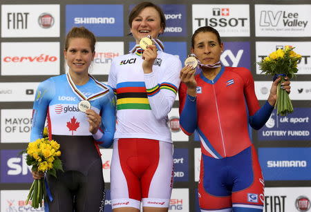 UCI World Track Cycling Championships - London, Britain - 5/3/2016 - Winner Katarzyna Pawlowska of Poland (C), second placed Jasmin Glaesser of Canada (L) and third placed Arlenis Sierra Canadilla of Cuba (R) pose on the podium of the women's points race final. REUTERS/Matthew Childs