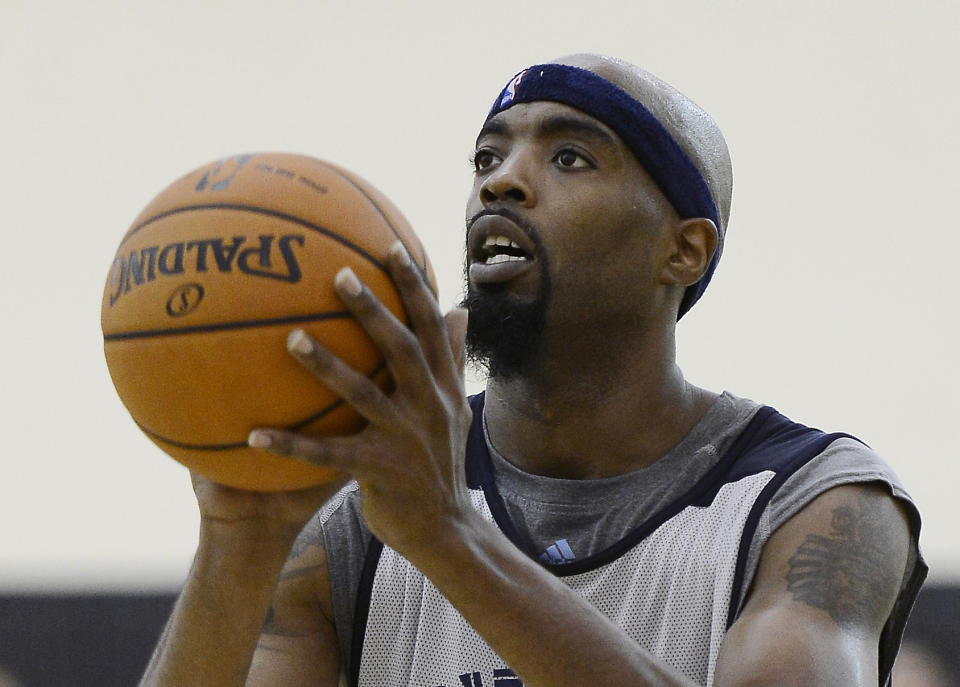 FILE - Memphis Grizzlies center Melvin Ely shoots free throws during NBA basketball training camp at Vanderbilt University in Nashville, Tenn., in this Wednesday, Oct. 2, 2013, file photo. Eighteen former NBA players, including Ely, have been arrested on charges alleging they defrauded the league's health and welfare benefit plan out of about $4 million, according to an indictment Thursday, Oct. 7, 2021. (AP Photo/Mark Zaleski, File)