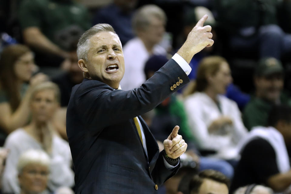 South Florida head coach Brian Gregory calls a play against Memphis during the first half of an NCAA college basketball game Sunday, Jan. 12, 2020, in Tampa, Fla. (AP Photo/Chris O'Meara)