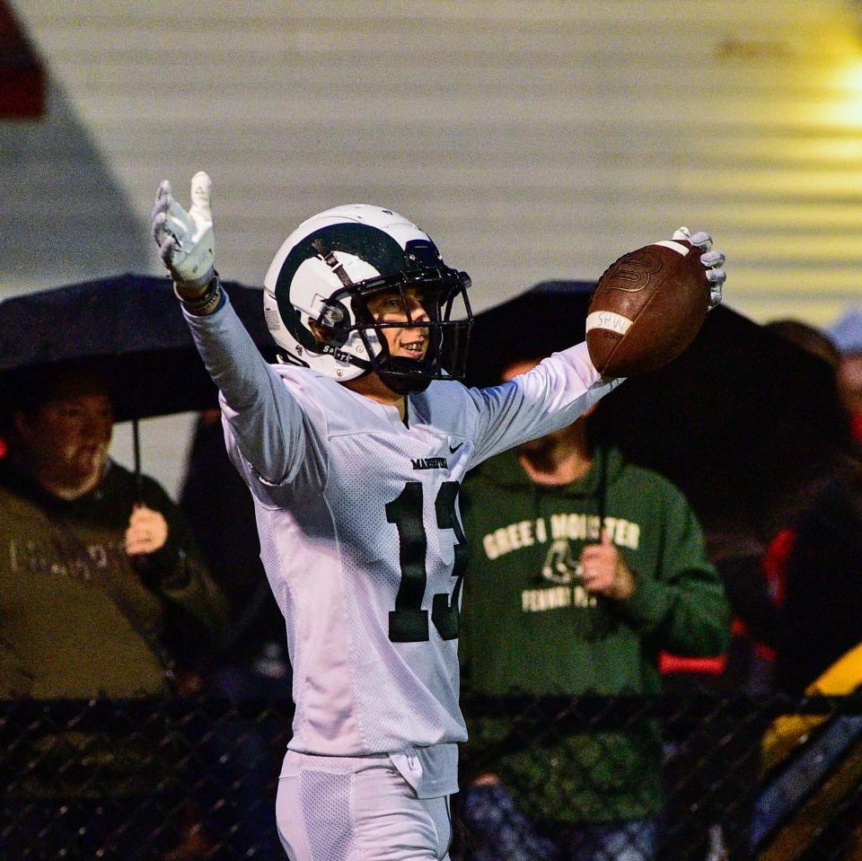 Marshfield’s Charlie Carroll celebrates after scoring a touchdown during Friday’s game against Bridgewater-Raynham.