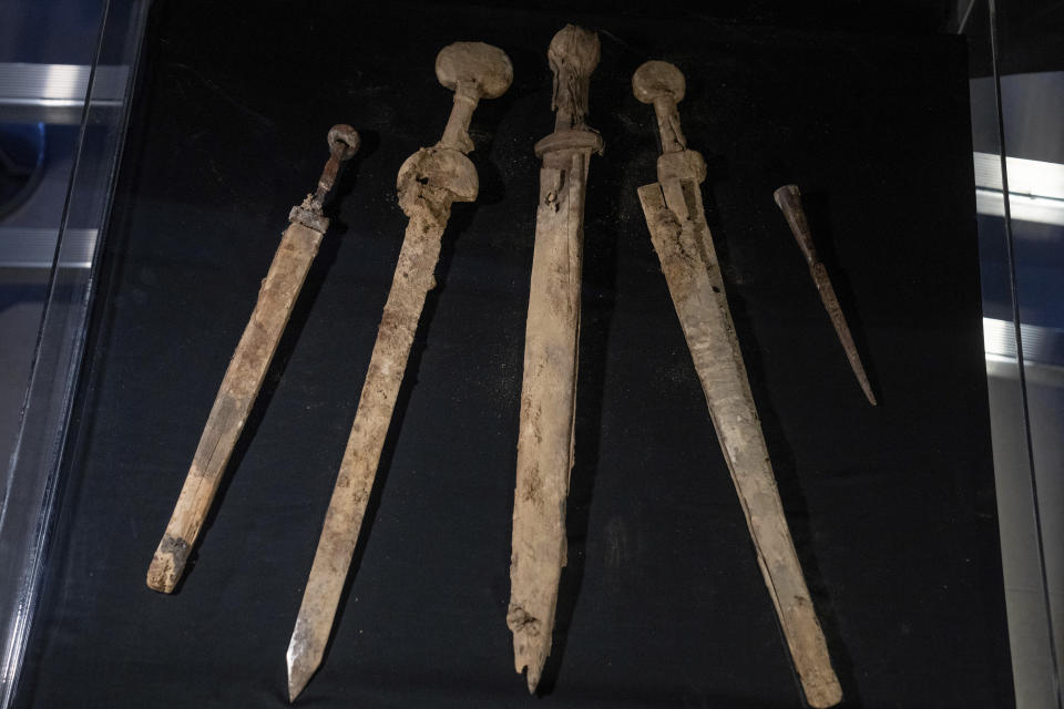 Israeli archaeologists show four Roman-era swords and a javelin head found during a recent excavation in a cave near the Dead Sea, in Jerusalem, Wednesday, Sep. 6, 2023. Archaeologists said the exceptionally preserved artifacts are dated to the 2nd century, when Jewish rebels launched an uprising against the Roman Empire. (AP Photo/Ohad Zwigenberg)