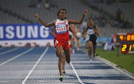 Bahrain's Maryam Yusuf Isa Jamal reacts as she crosses the finish line to win the women's 1500m final at the Incheon Asiad Main Stadium during the 17th Asian Games September 29, 2014. REUTERS/Jason Reed