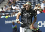 Stefanos Tsitsipas, of Greece, returns a shot to Andrey Rublev, of Russia, during the first round of the US Open tennis tournament Tuesday, Aug. 27, 2019, in New York. (AP Photo/Kevin Hagen)