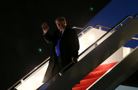 U.S. President Donald Trump waves to the news media as he exits Air Force One after returning from Vietnam to Joint Base Andrews in Maryland, U.S., February 28, 2019. REUTERS/Leah Millis