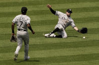 Chicago White Sox left fielder AJ Pollock (18) can't catch a single hit by Kansas City Royals' Hunter Dozier during the fourth inning in the first game of a baseball doubleheader Tuesday, May 17, 2022, in Kansas City, Mo. (AP Photo/Charlie Riedel)