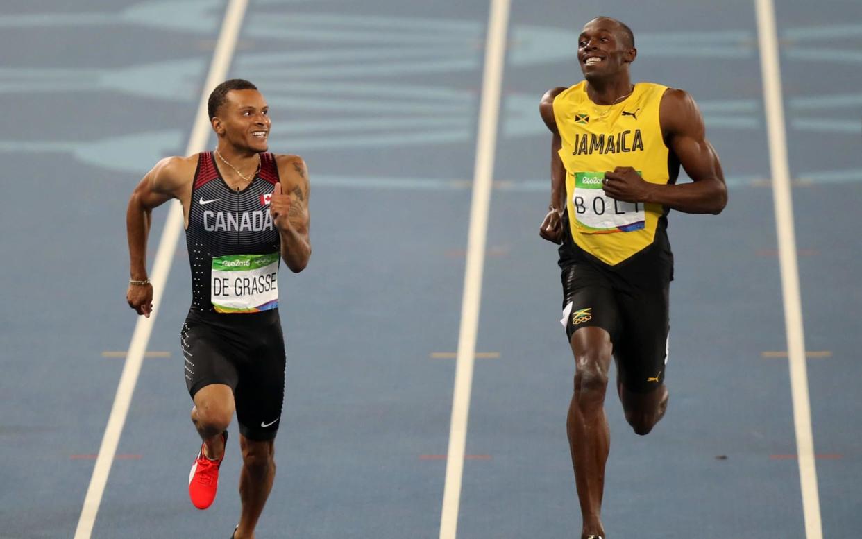 Canada's Andre De Grasse (left) and Jamaica's Usain Bolt compete - PA