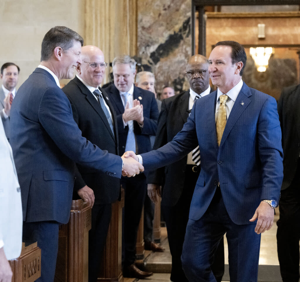 Louisiana Gov. Jeff Landry, right, greets Rep. Raymond Crews, R-Bossier City, before giving his address in the House Chamber on opening day of the regular legislative session, Monday, March 11, 2024, at the Louisiana State Capitol in Baton Rouge.