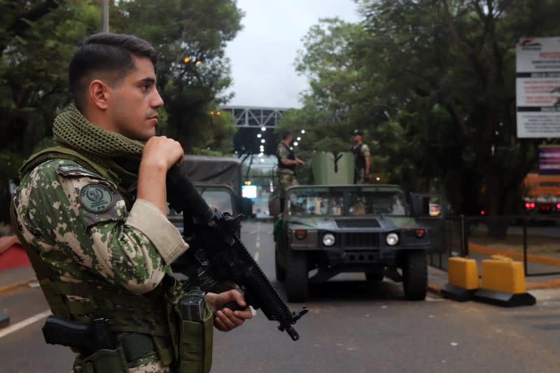 Paraguayan soldiers patrol the Friendship Bridge that connects Ciudad del Este in Paraguay with Foz do Iguacu in Brazil after the border closure due to the coronavirus disease (COVID-19) outbreak in Ciudad del Este, Paraguay