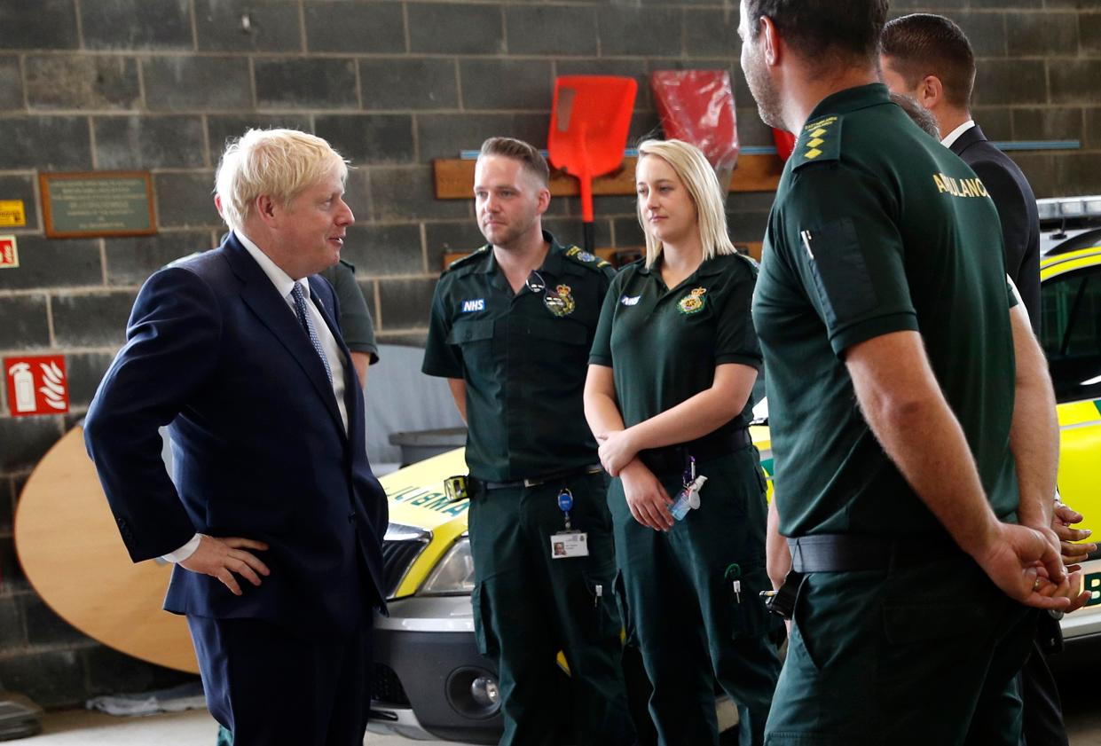 Boris Johnson chats with Ambulance crews during a visit to Pilgrim Hospital in Boston, eastern England, on Monday. (Getty)