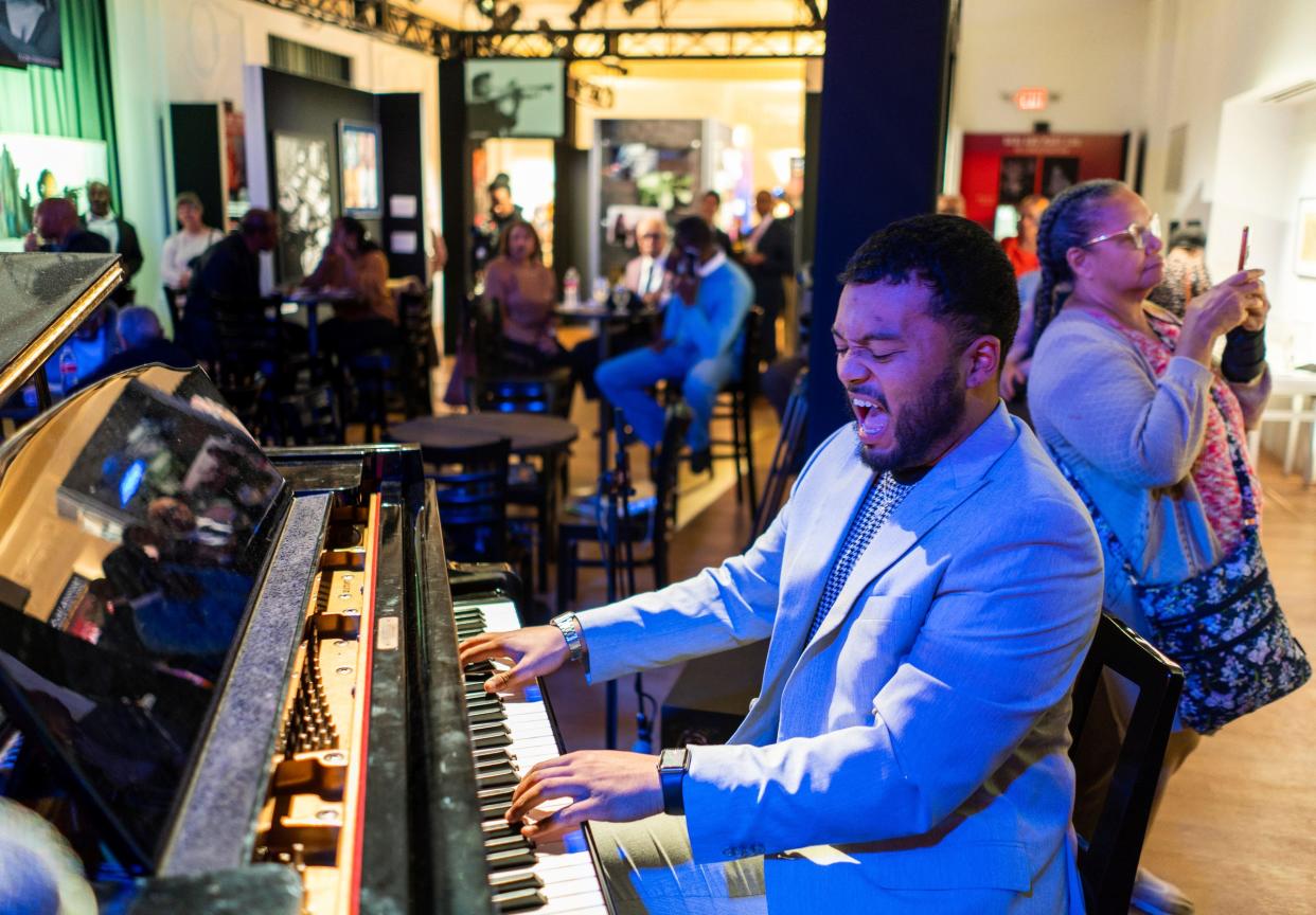 Musician Kasan Belgrave of Detroit plays the piano with other musicians during a VIP event at the Carr Center Performance Studio in Detroit on Thursday, Oct. 13, 2022.