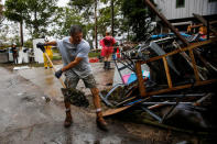 People clean their house after the passing of Hurricane Florence in New Bern, North Carolina, U.S., September 16, 2018. REUTERS/Eduardo Munoz