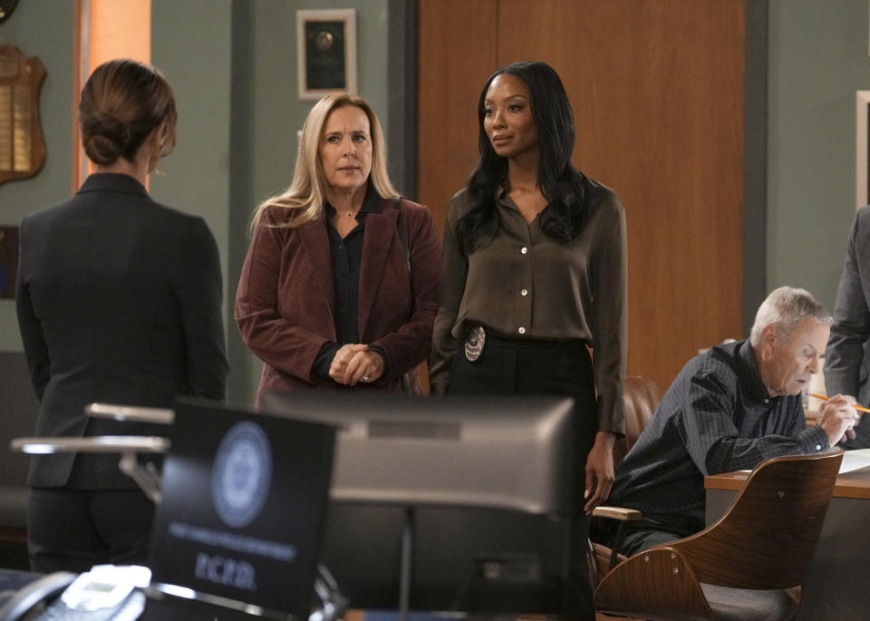This image released by ABC shows Genie Francis, center left, and Tanisha Harper in a scene from "General Hospital." (Troy Harvey/ABC via AP)