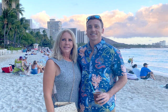 Vicki Gunvalson and her son, Michael Wolfsmith, take a photo on a beach.