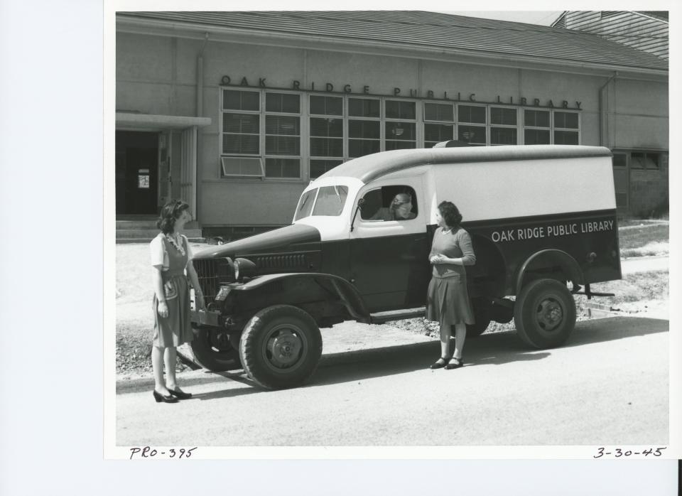 First library director Elizabeth Edwards driving the mobile book vehicle on March 30, 1945.