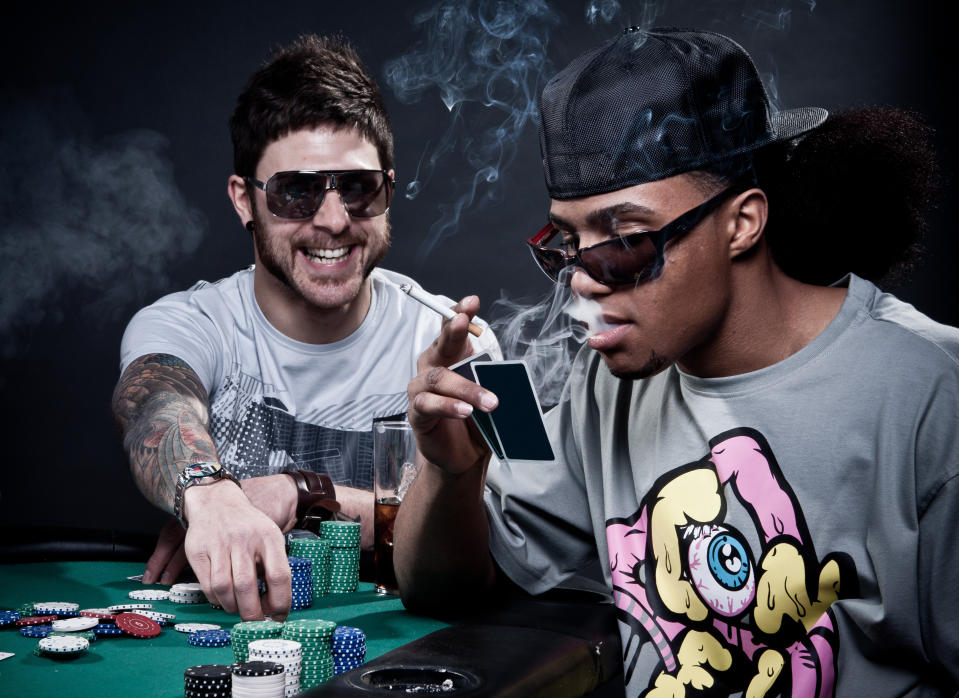 Men smoking and gambling