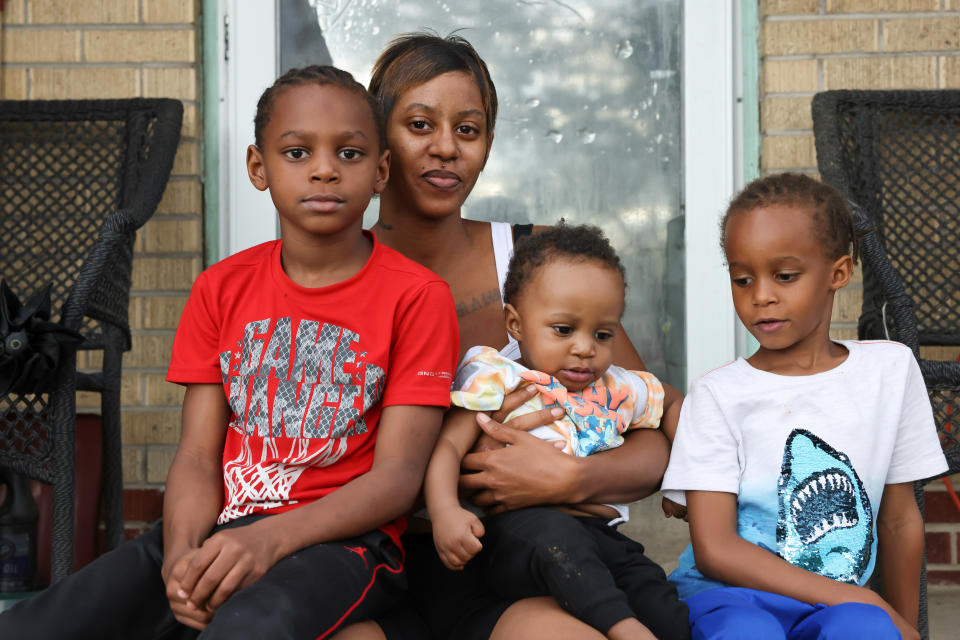 Vanessa Peoples with her sons Tamaj, 7, Mahjae, 6, and Zamari, 11 months, outside her home in Aurora, Colo. (Kevin Mohatt / for NBC News)