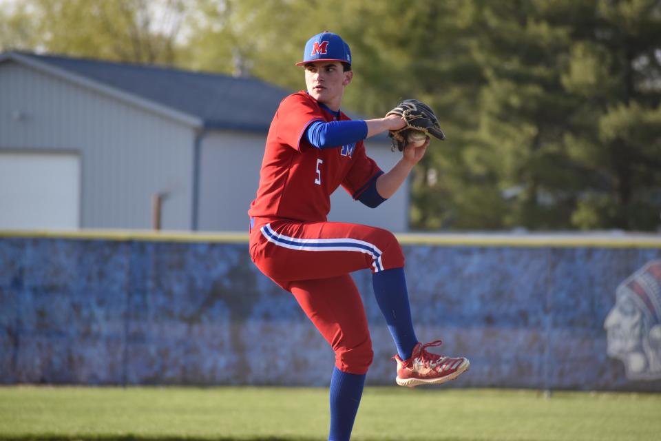 Martinsville's Kevin reed prepares to throw a pitch during the Artesians' Mid-State matchup with Whiteland on April 26, 2022.