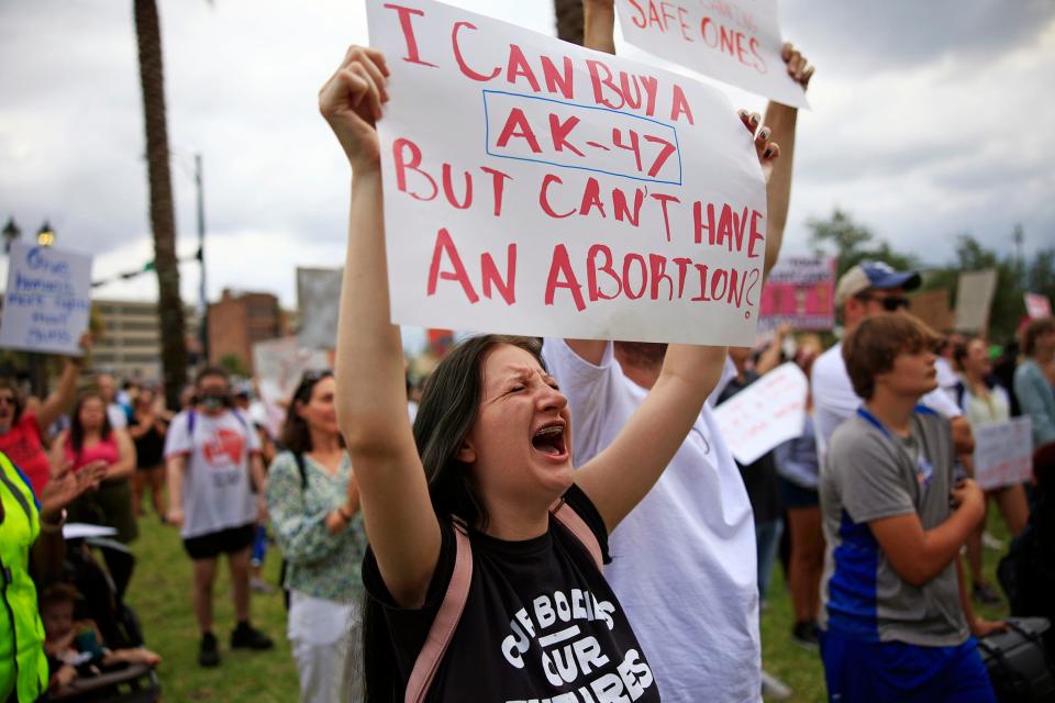 Arabella Carns yells during a protest Friday, June 24, 2022 in downtown Jacksonville. Hundreds came out express disappointment in today's Supreme Court 5-4 overturning the 1973 Roe vs. Wade case. The decision eliminated the constitutional right to an abortion. The crowd protested with signs and chants outside the Duval County Courthouse, hosted speakers, and capped off the night with a march through downtown. 