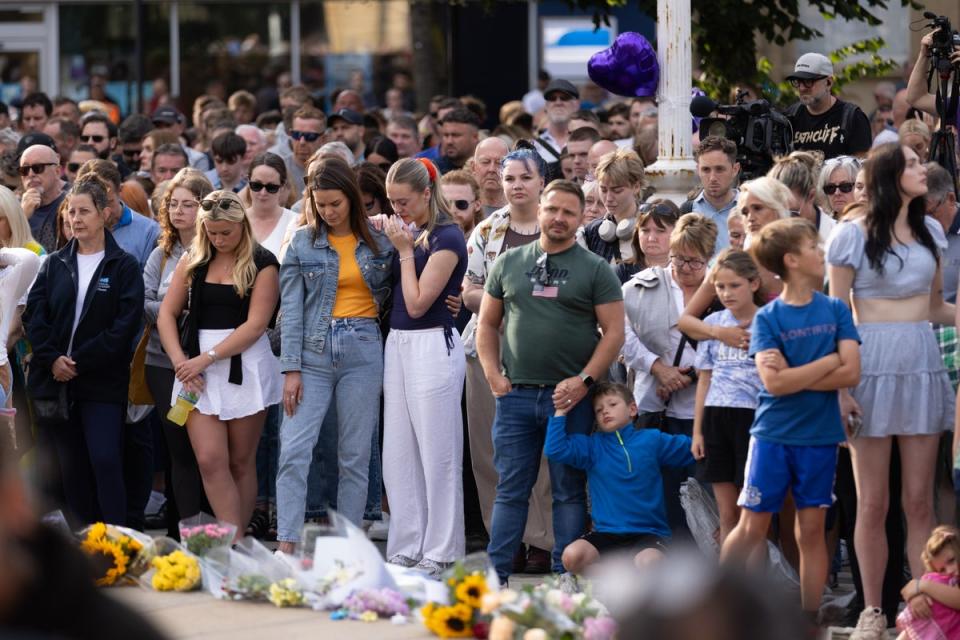 Crowds fought back tears during a vigil on Tuesday night before disorder erupted (James Speakman/PA Wire)