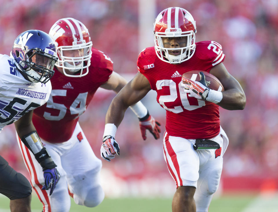 Oct. 12, 2013; Madison; Wisconsin Badgers running back James White (20) rushes with the football during the fourth quarter against the Northwestern Wildcats at Camp Randall Stadium. Wisconsin won 35-6. Jeff Hanisch-USA TODAY Sports