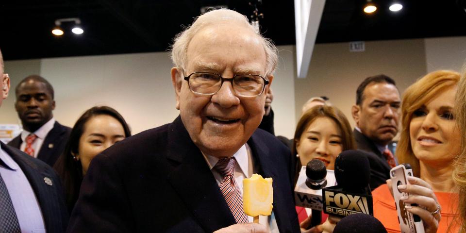 FILE PHOTO: Berkshire Hathaway chairman and CEO Warren Buffett enjoys an ice cream treat from Dairy Queen before the Berkshire Hathaway annual meeting in Omaha, Nebraska, U.S. May 6, 2017. REUTERS/Rick Wilking/File Photo