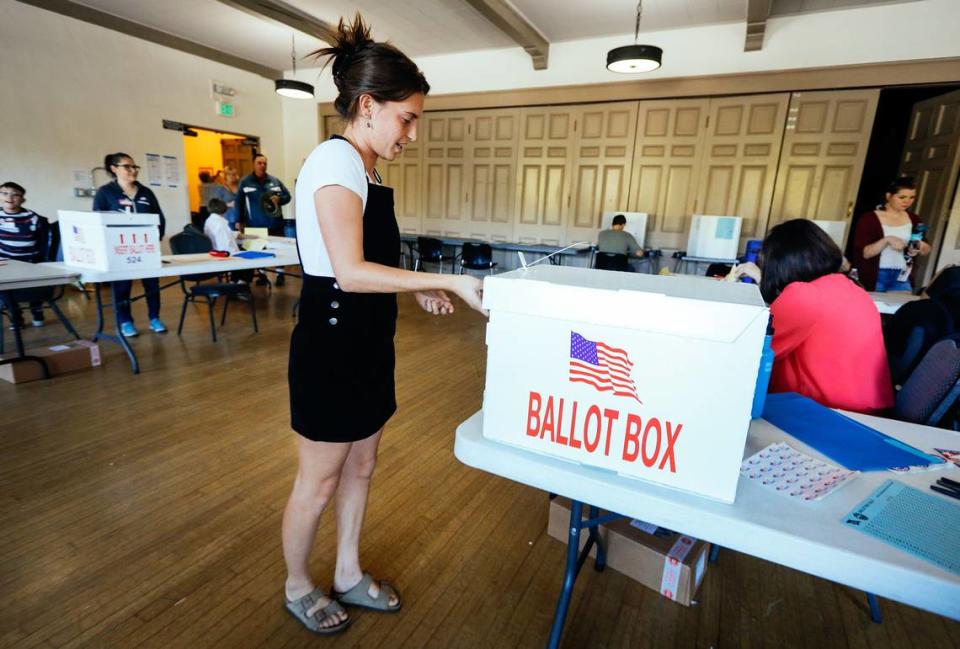 Brenna Merchant puts her ballot in the ballot box after voting Tuesday at the San Luis Obispo Veterans Memorial Building. Joe Johnston/jjohnston@thetribunenews.com