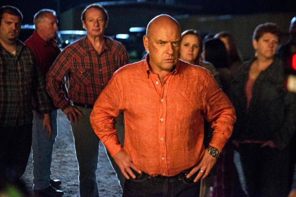 This publicity image released by CBS shows Dean Norris as James "Big Jim" Rennie, a town leader on the series "Under the Dome," airing Mondays at 10 p.m. on CBS. Norris will also appear in the final season of the hit series "Breaking Bad," premiering Sunday at 9 p.m. EST on AMC. (AP Photo/CBS, Brownie Harris)