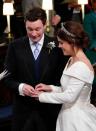 <p>The traditional Welsh gold band seemed a little tight as he attempted to slip it over his bride's finger. Like Prince William, he opted go without a band himself, <em><a rel="nofollow noopener" href="https://people.com/royals/princess-eugenie-royal-wedding-jack-brooksbanks-rings/" target="_blank" data-ylk="slk:People;elm:context_link;itc:0;sec:content-canvas" class="link ">People</a> </em>reports. </p>