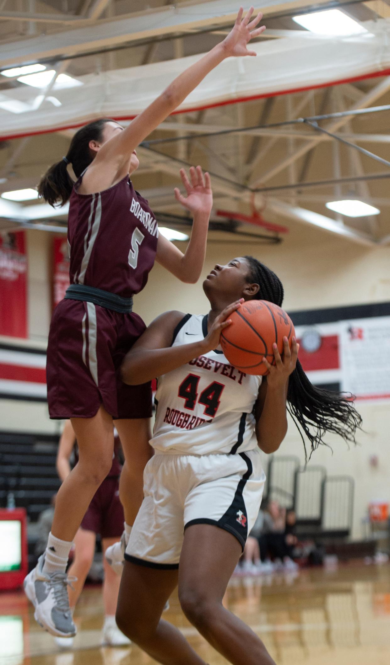 Kent Roosevelt 46 Boardman 49, Rough Riders had a second half boost but came up short in a first round tournament. Saniya Moxley takes a shot, Samantha Duble on defense.