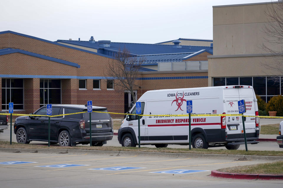 Emergency vehicles remain parked at the Perry Middle School and High School building, Friday, Jan. 5, 2024, in Perry, Iowa, the day after a shooting. (AP Photo/Bryon Houlgrave)