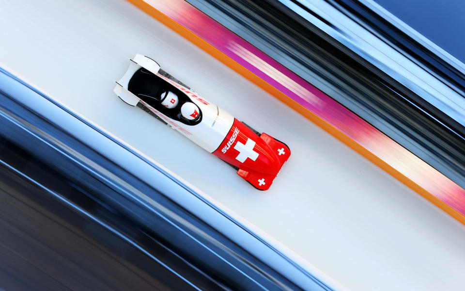  Rico Peter of Switzerland pilots a run during a Men's Two-man Bobsleigh training session during the Sochi 2014 Winter Olympics at the Sanki Sliding Center on February 13, 2014 in Sochi, Russia. 