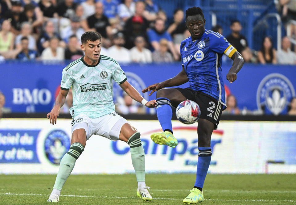 CF Montreal's Victor Wanyama, right, wins the ball from Atlanta United's Miguel Berry during the first half of an MLS soccer match Saturday, July 8, 2023, in Montreal. (Graham Hughes/The Canadian Press via AP)