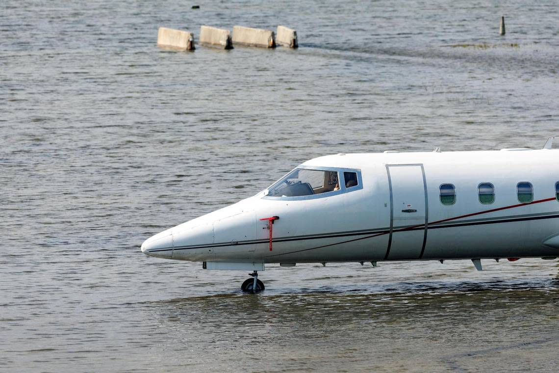 A private jet charter sits in floodwaters at Fort Lauderdale-Hollywood International Airport on Thursday, April 13, 2023. The airport reopened Friday after it was shut down on Wednesday, when Fort Lauderdale was drenched with more than 2 feet of rain.