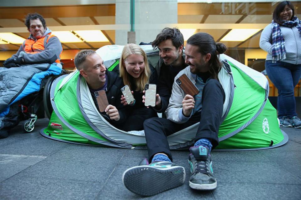 The Mous team camped outside the Sydney Apple Store to be one of the first to get the new phones (Getty)