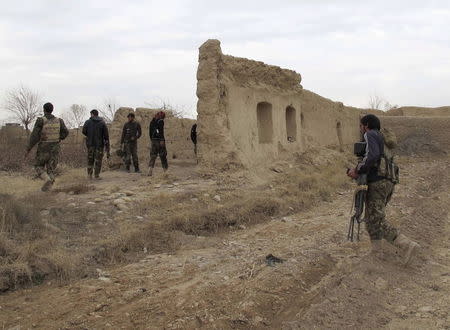 Afghan National Army (ANA) soldiers patrol at an outpost in Helmand province, Afghanistan, in this December 25, 2015 file photo. REUTERS/Abdul Malik/Files