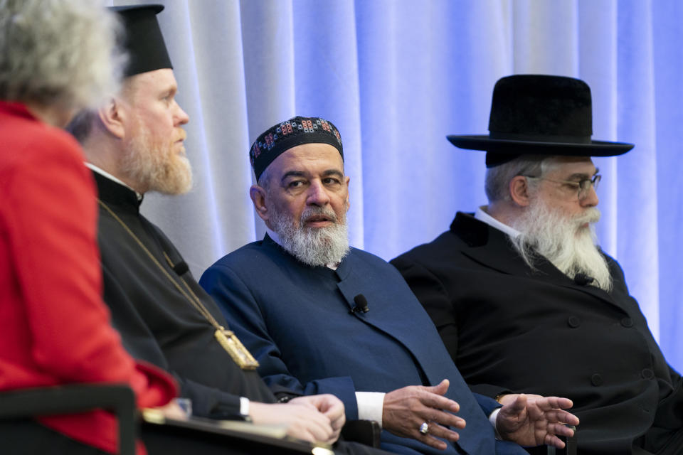 Mufti Akhmed Tamim, center, speaks during a panel discussion among an interfaith delegation of Ukrainian religious leaders including archbishop Yevstratiy Zorya, second from left, and Rabbi Yaakov Dov Bleich, right, while former U.S. ambassador to Ukraine Marie Yovanovitch, left, moderates, on Monday, Oct. 30, 2023, at the U.S. Institute of Peace in Washington. (AP Photo/Stephanie Scarbrough)