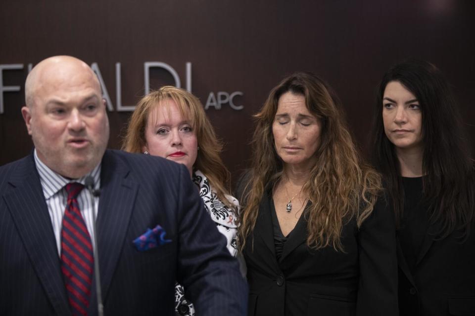 An attorney accompanied by female clients.